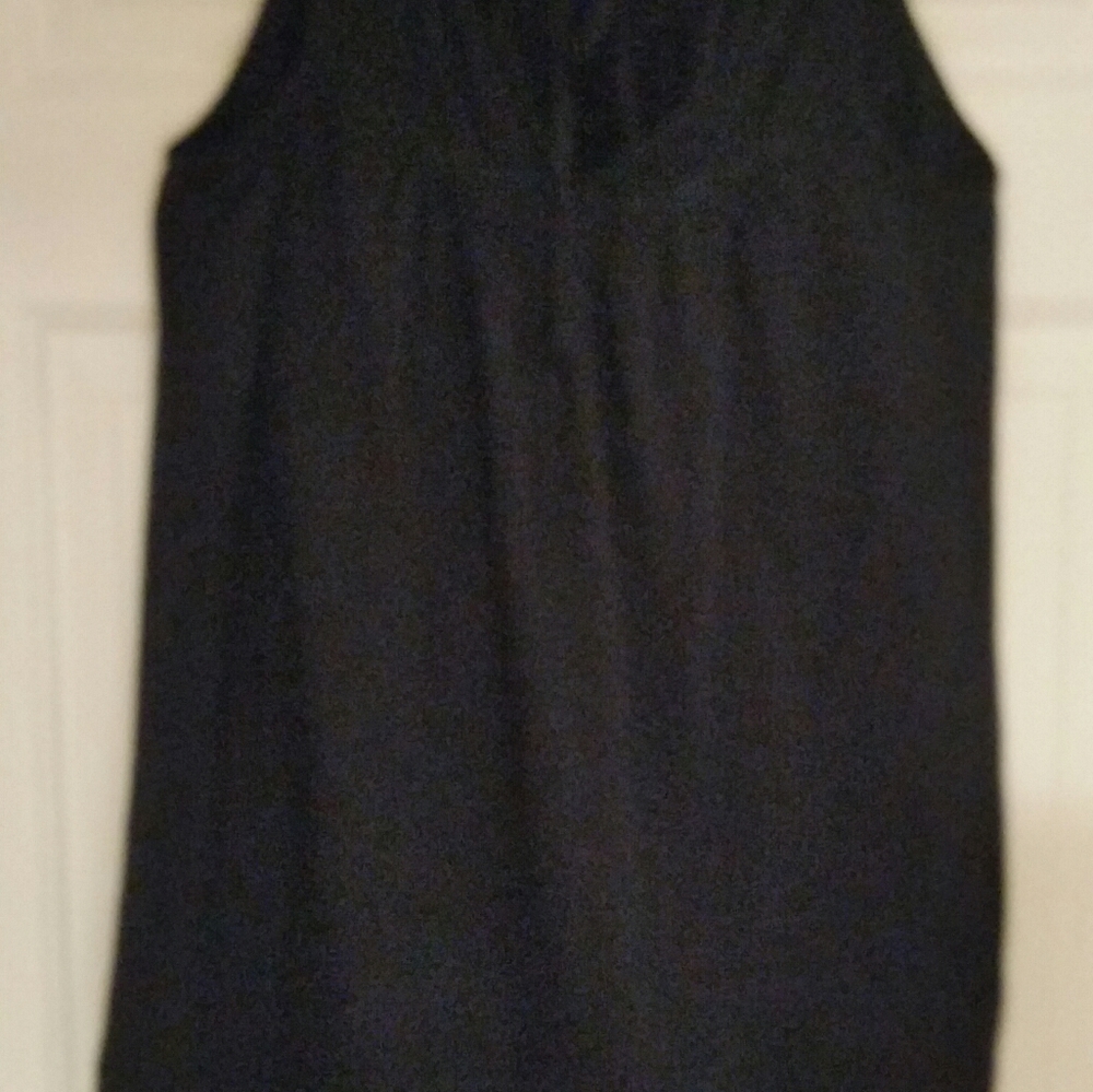 Tank top with opening and tie in the back.